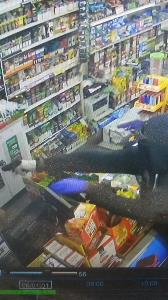 Armed robbery suspect wearing two different gloves